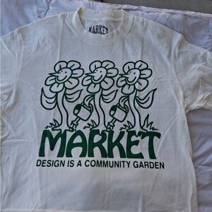 White T-Shirt with Green Flower Design